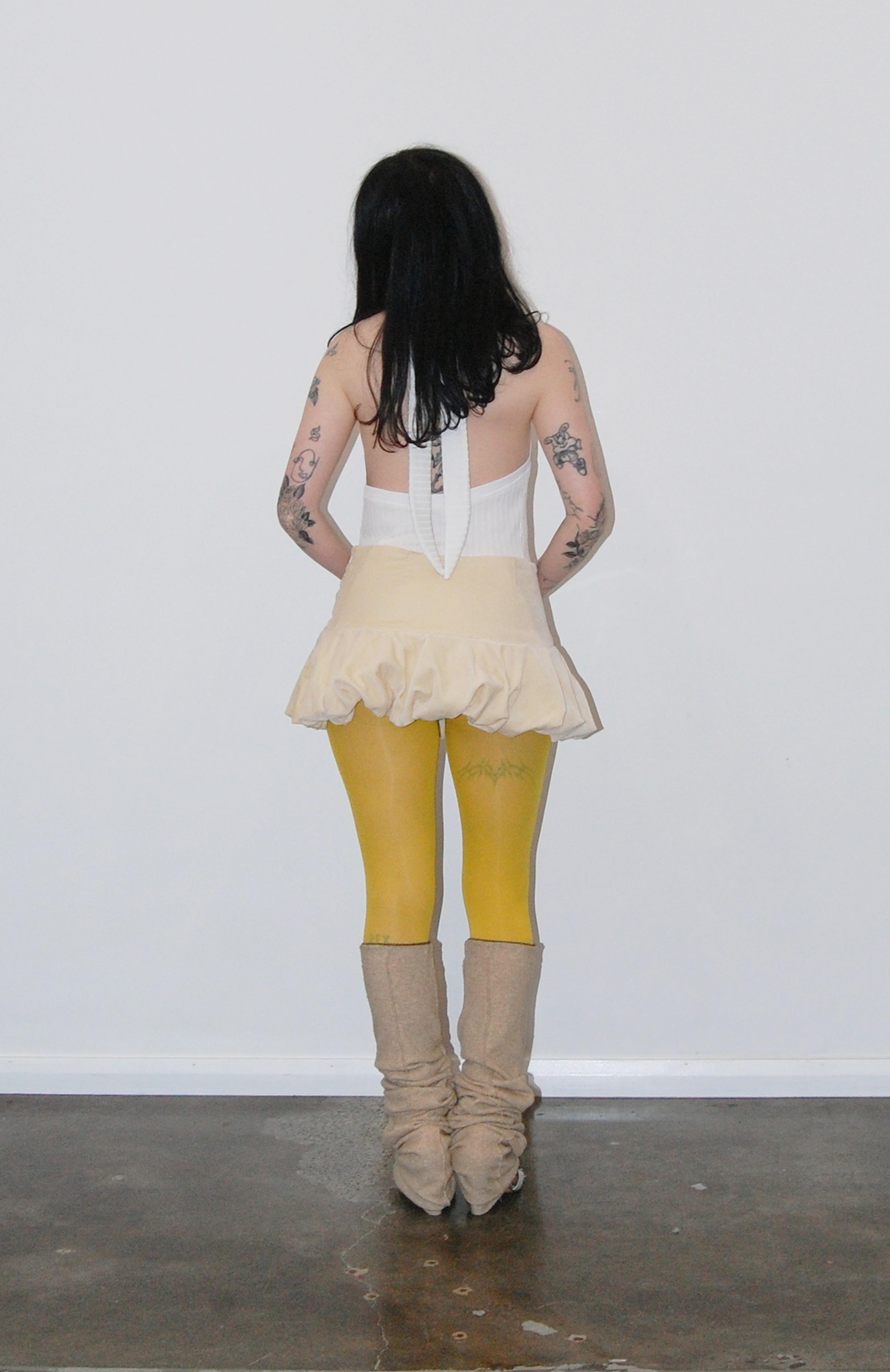 Maroske Peech A flirty playful bubble mid waisted mini skirt that salutes the fashion trends of the 1980s. This mid rise puffball style is created with a crinoline inner foundation to hold its balloon-like shape. A wonderful way to add volume to a silhouette.