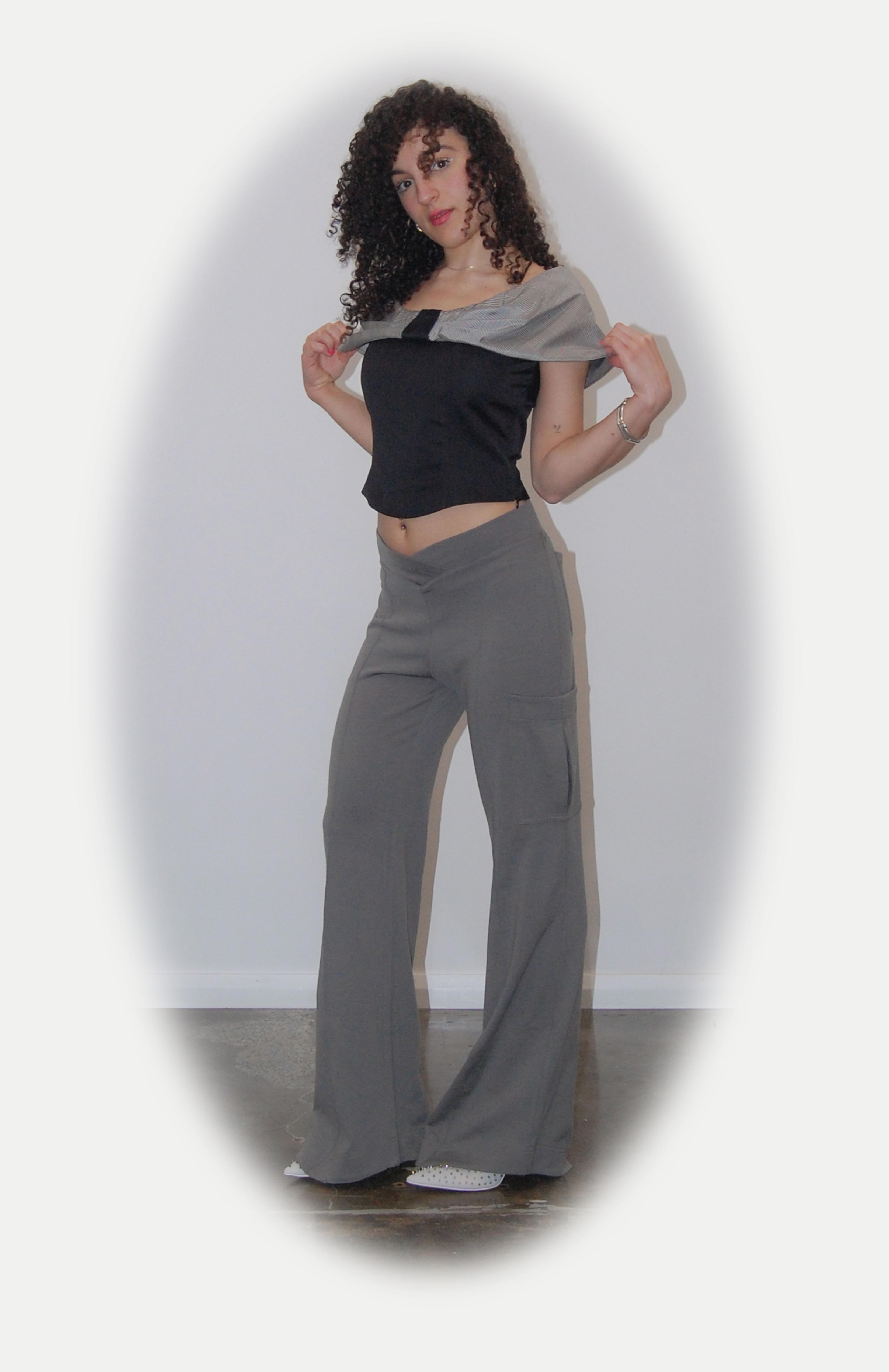 Relaxed cargo track pant with a V-shaped elasticated waist. 3D saddle pockets positioned on the side of the leg and back patch pockets for extra added storage. Finished with a flared leg and shaped hem.
