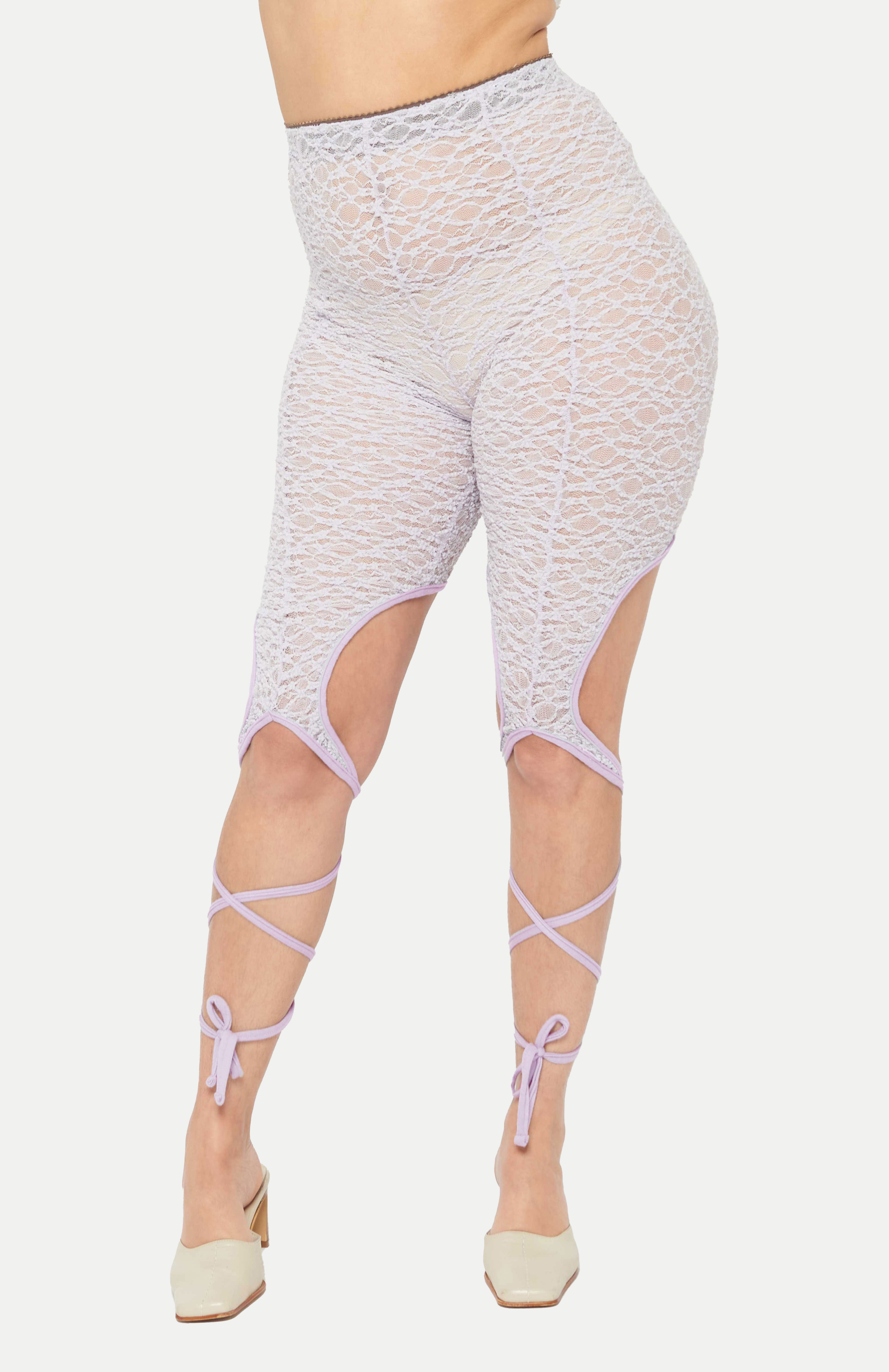 The return of a Maroske Peech classic. Features a high waisted antique lace fabrication with tendrils that grow from the knee. A spell is cast when these tendrils are wrapped around your legs and tied. Super comfortable and stretchy with a branded brushed elastic waistband.