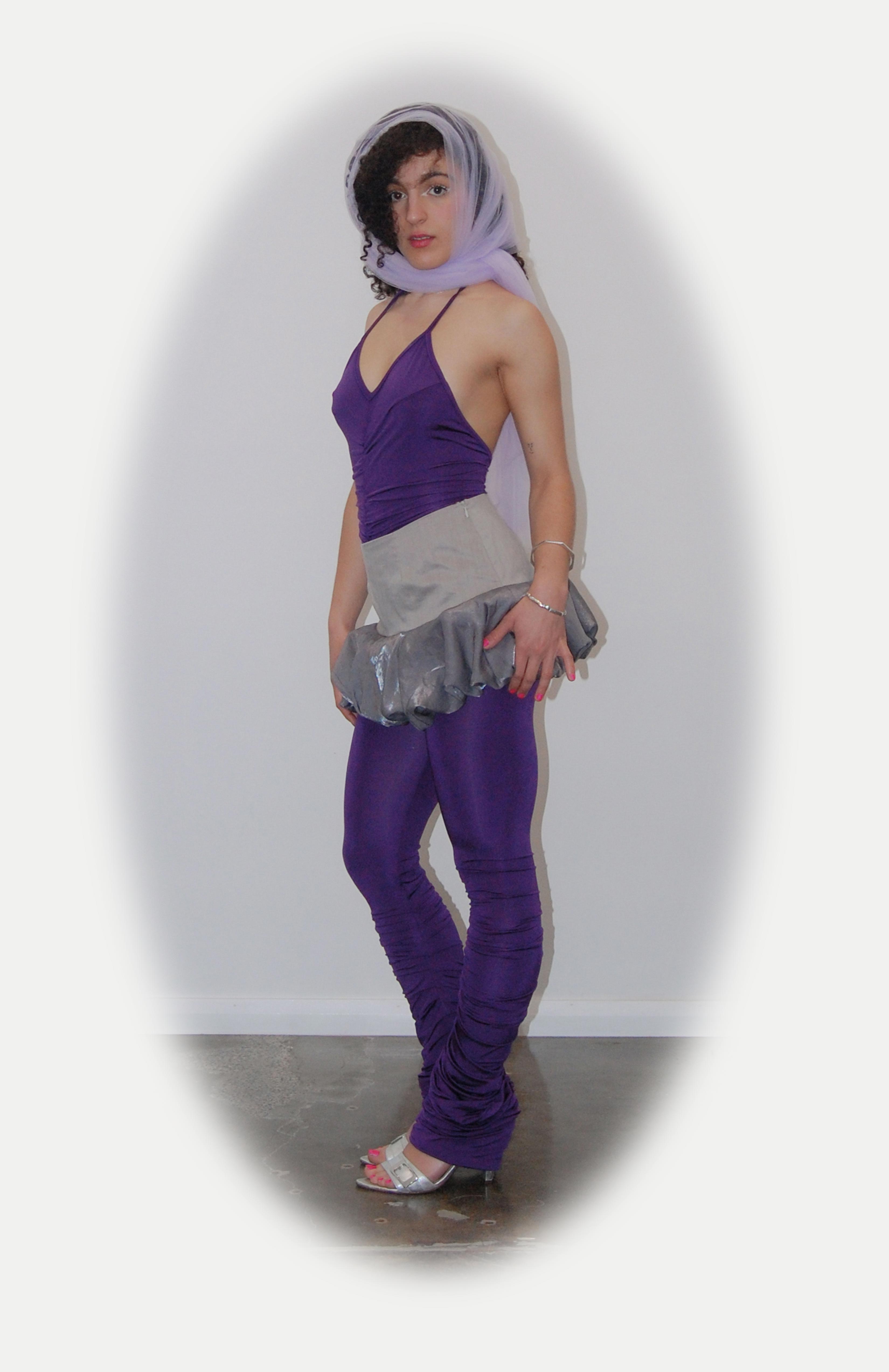 mid waisted mini skirt that salutes the fashion trends of the 1980s. This mid rise puffball style is created with a crinoline inner foundation to hold its balloon-like shape. A wonderful way to add volume to a silhouette.