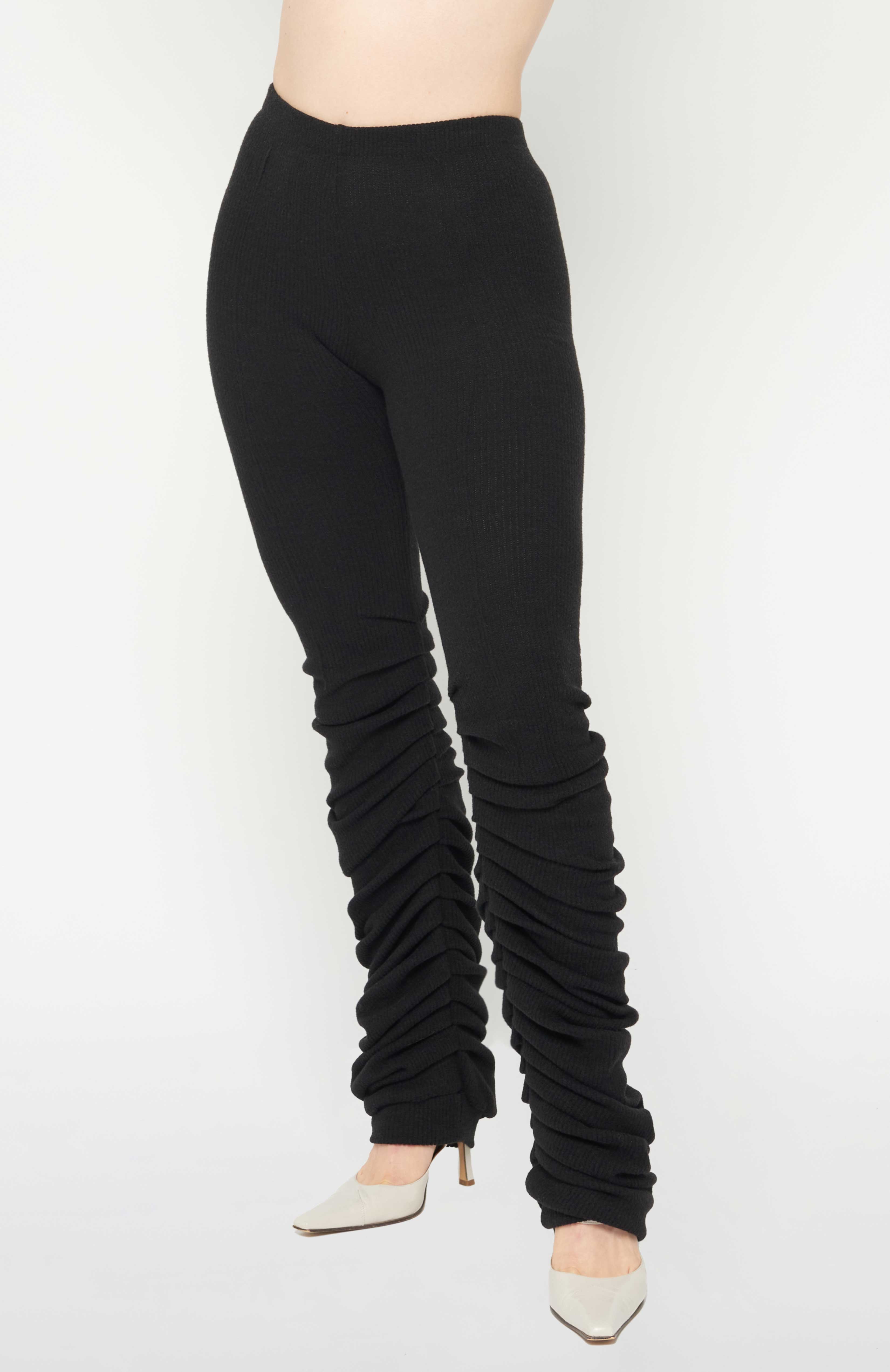 Maroske Peech High-rise wool-blend warm-up black leggings. Pleated inseam starts from the knee for a lamb leg effect. Flattering pin tucks run along the back and front of both legs giving you visual cues to correct your lines in the mirror.