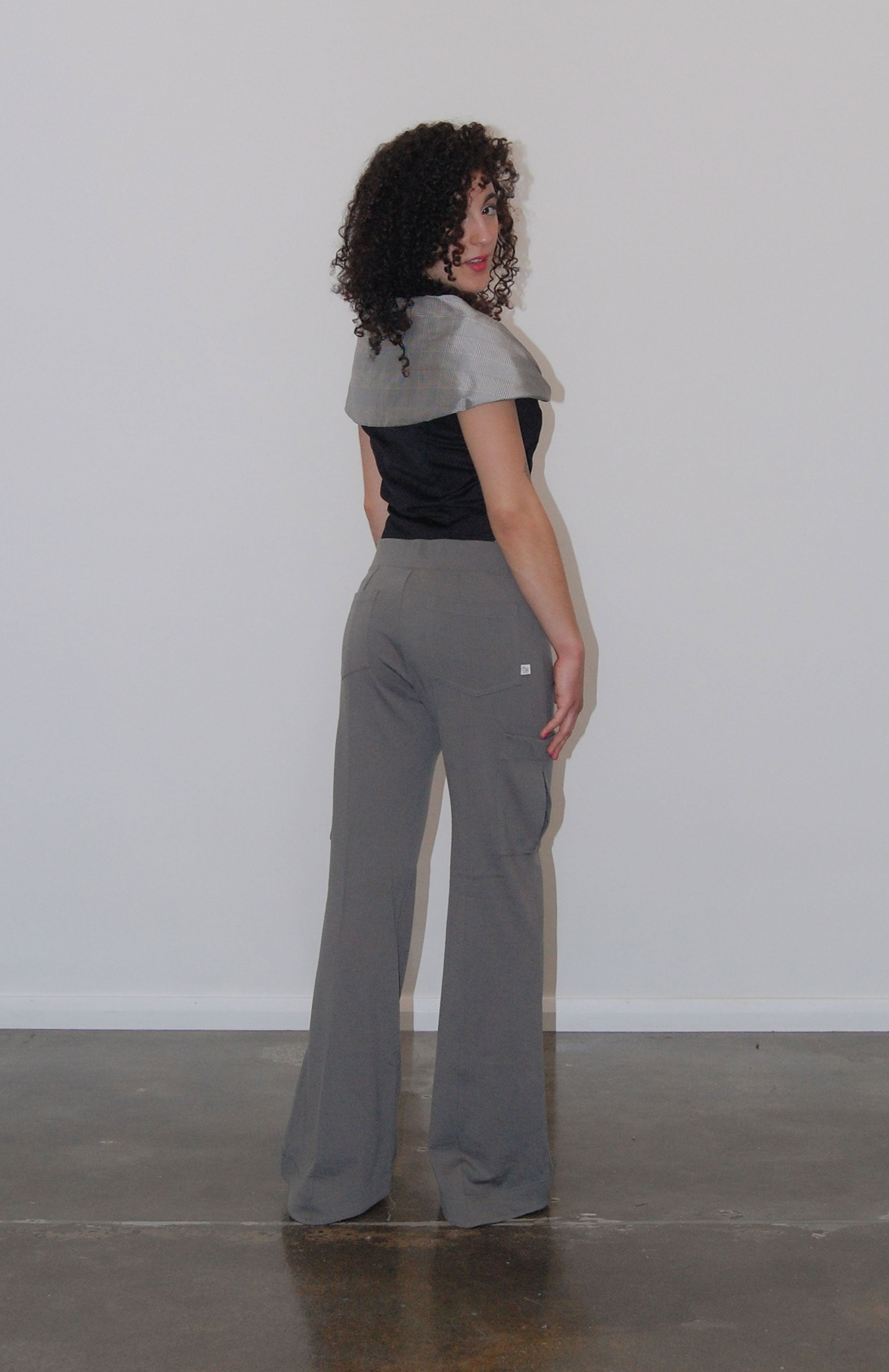 Relaxed cargo track pant with a V-shaped elasticated waist. 3D saddle pockets positioned on the side of the leg and back patch pockets for extra added storage. Finished with a flared leg and shaped hem.