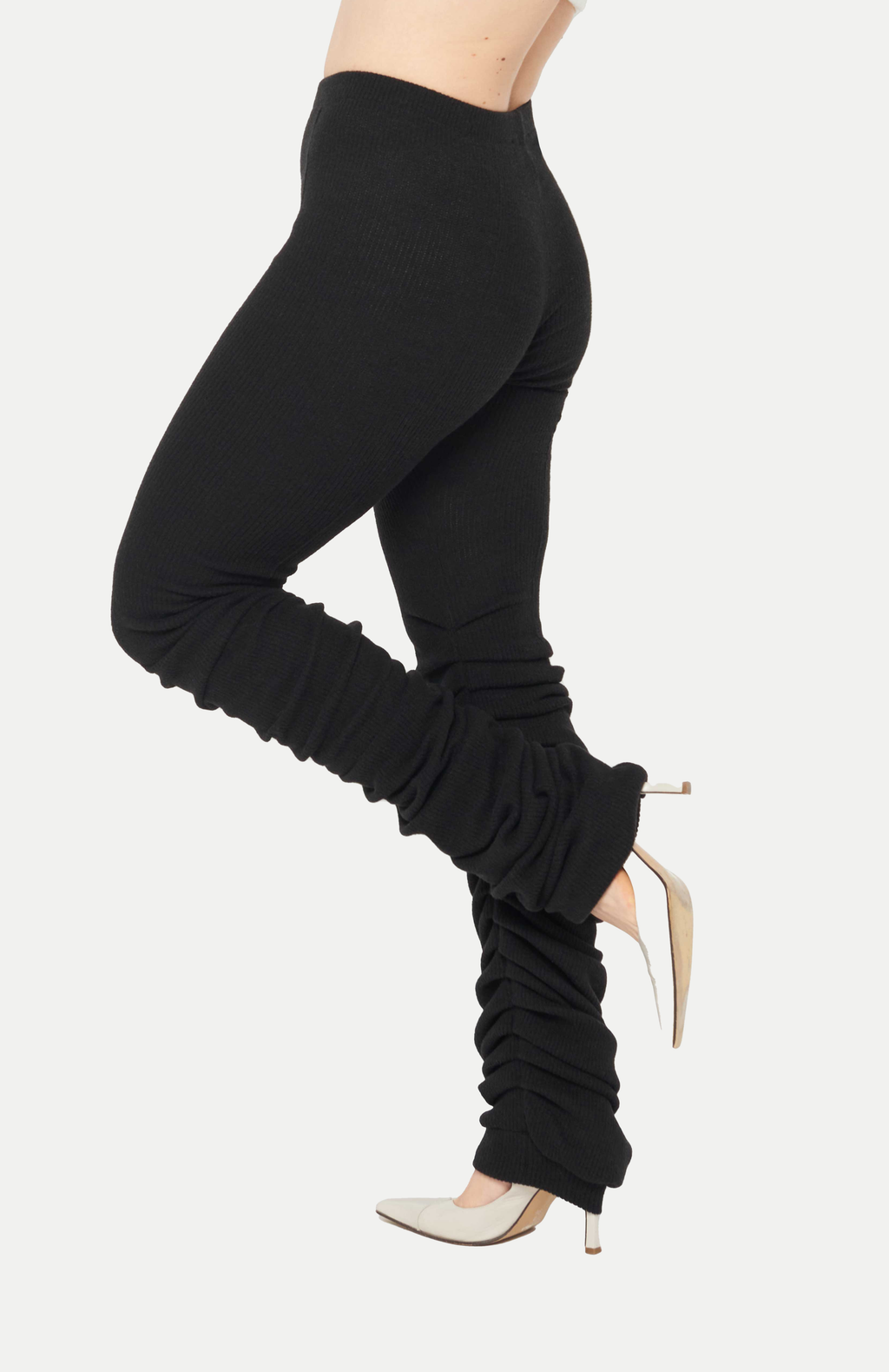 Maroske Peech High-rise wool-blend warm-up black leggings. Pleated inseam starts from the knee for a lamb leg effect. Flattering pin tucks run along the back and front of both legs giving you visual cues to correct your lines in the mirror.