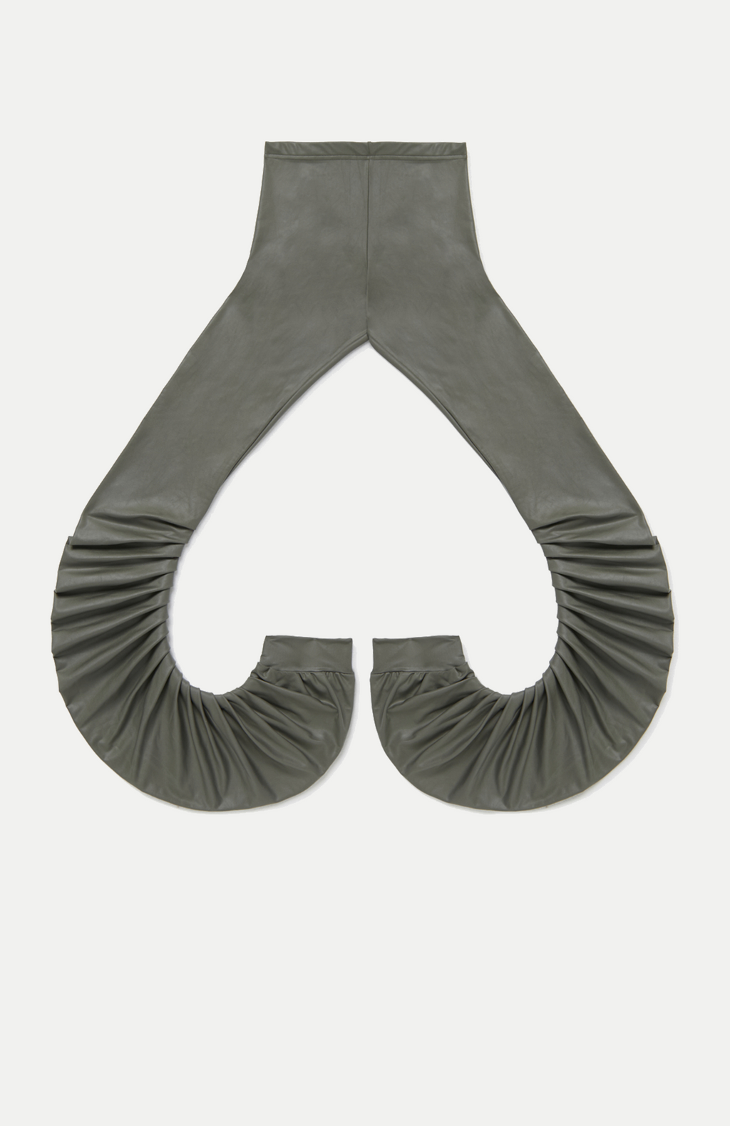 High rise iron coloured wet look leggings with a pleated inseam. Volume starts from the knee and drapes down over the foot for a lamb leg effect.