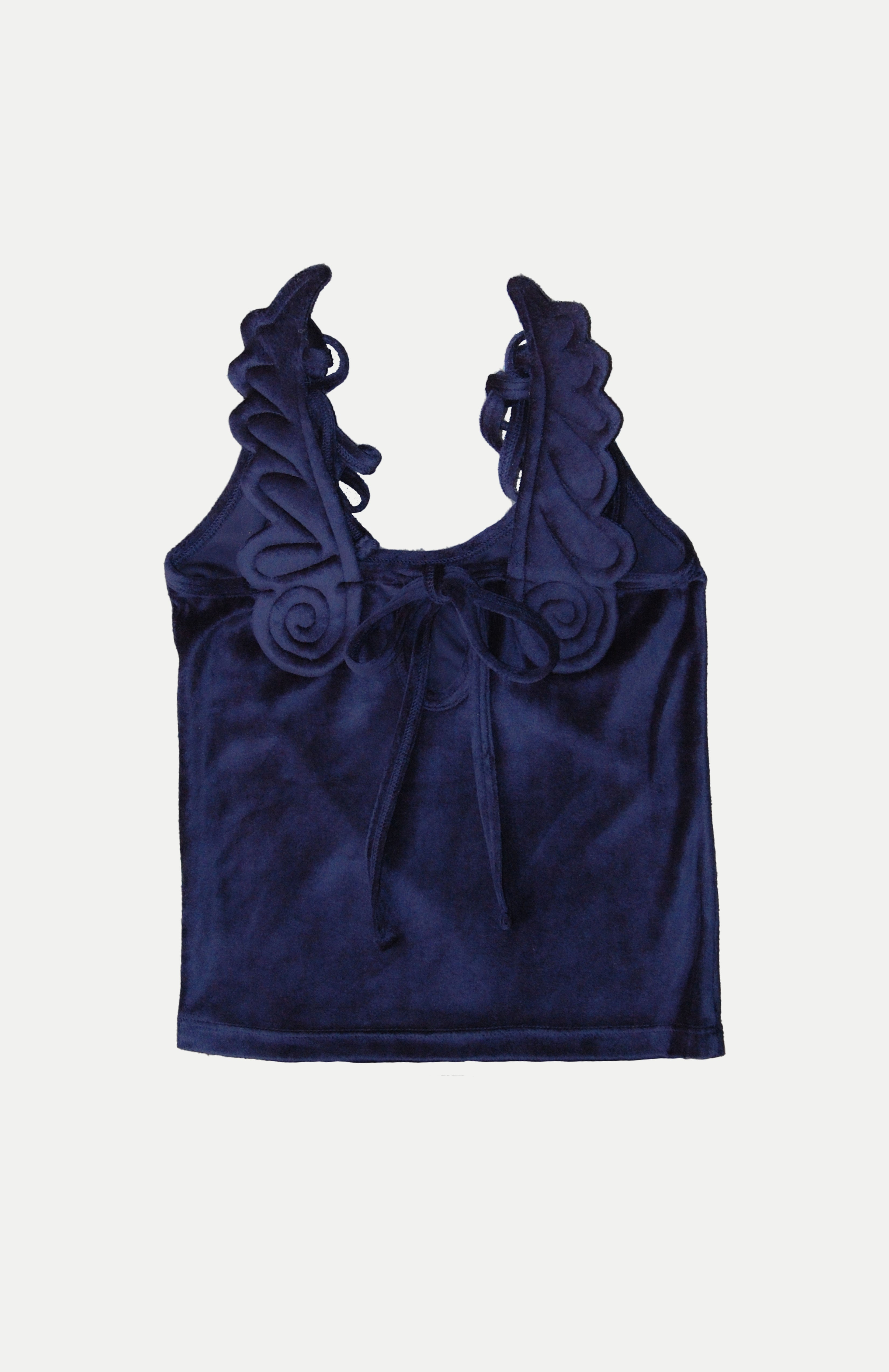 'she wore blue velvet, bluer than velvet was the night..'  This special edition version of the Maroske Peech Signature Angel Camisole features handmade plushie angel wings, dual shoulder straps and a keyhole opening at the back tied closed with a bow. Interchangeable style allowing you to wear with wings on the front or back.  Made from a luxurious stretch navy velour, only a total of 15 pieces exist in this colourway, the newest edition to our collectors suite of styles.