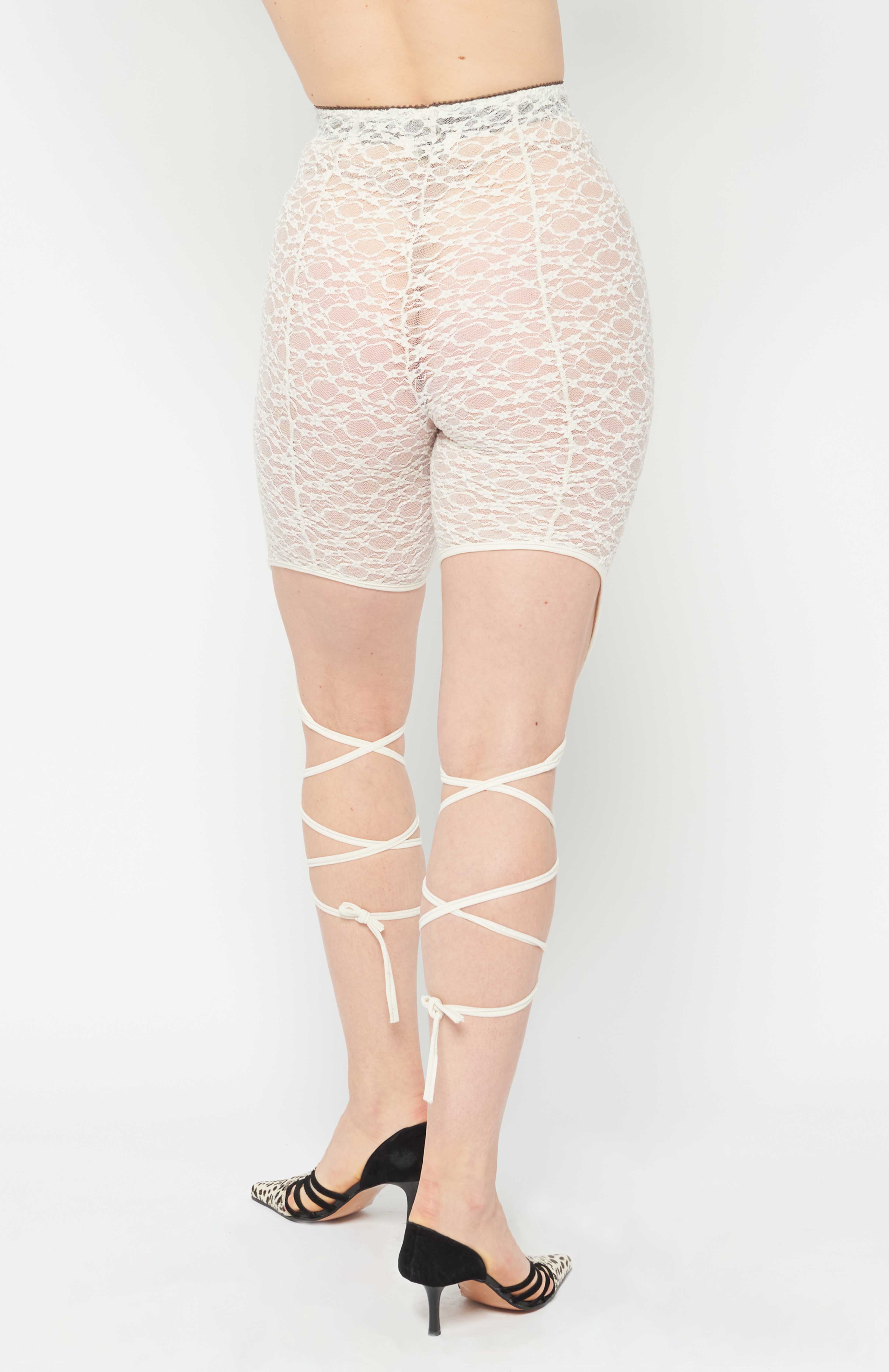 Maroske Peech High waisted ivory lace leggings with tendrils that grow from the knee. A spell is cast when these tendrils are wrapped around your legs and tied. Super comfortable and stretchy with a brushed elastic waistband.