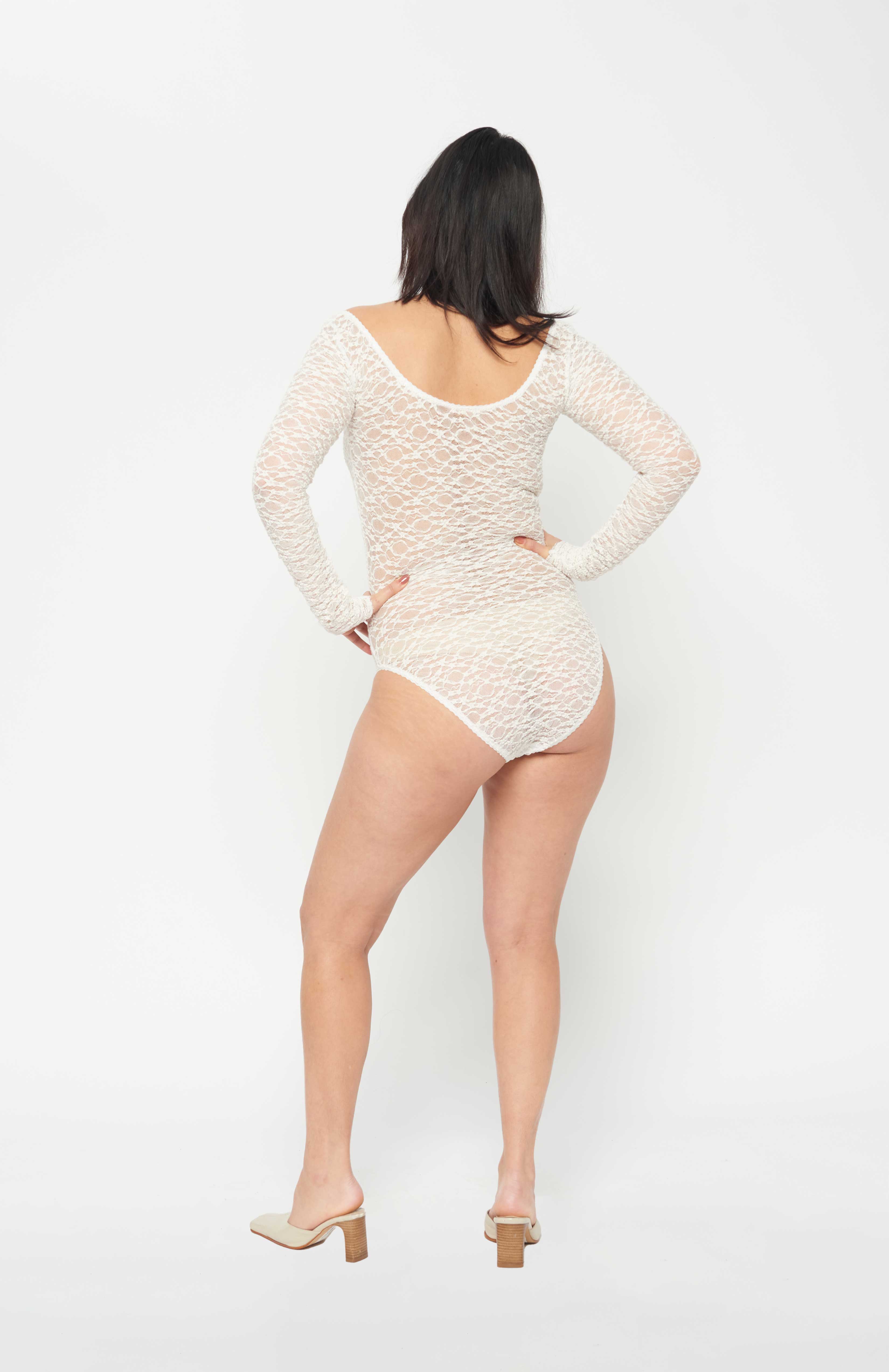 Maroske Peech A reprise of our signature stretch soft cup leotard in stunning ivory lace. Features a snap opening at gusset for ease wearer and zig-zag decorative stitching with a scalloped elastic detail. 