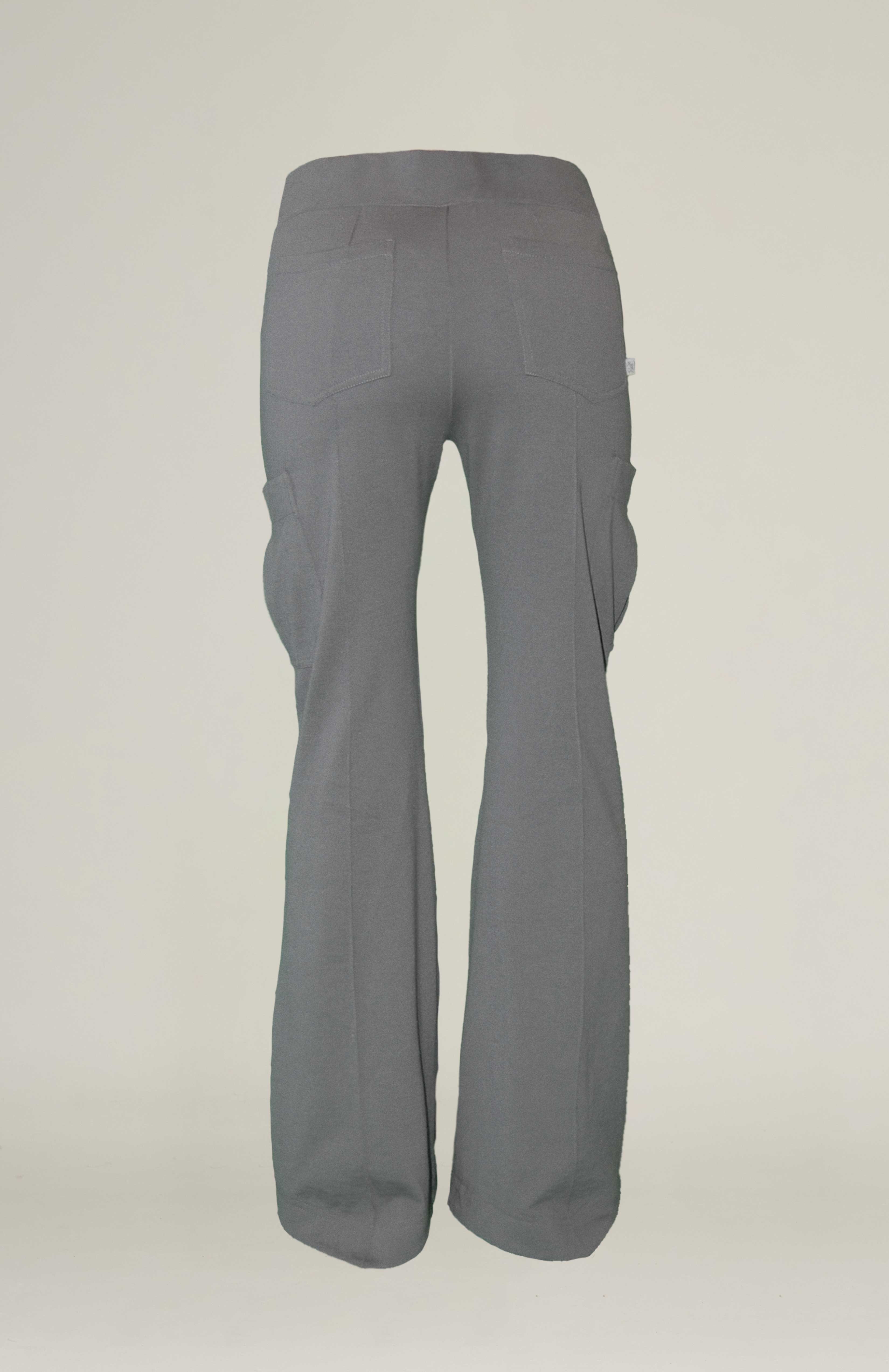 Relaxed cargo track pant with a V-shaped elasticated waist. 3D saddle pockets on side of leg and back patch pockets for extra added storage. Pin tucks run down the front and back of the legs to enhance length. Finished with a flared leg and shaped hem. Can be dressed up or down. BACK