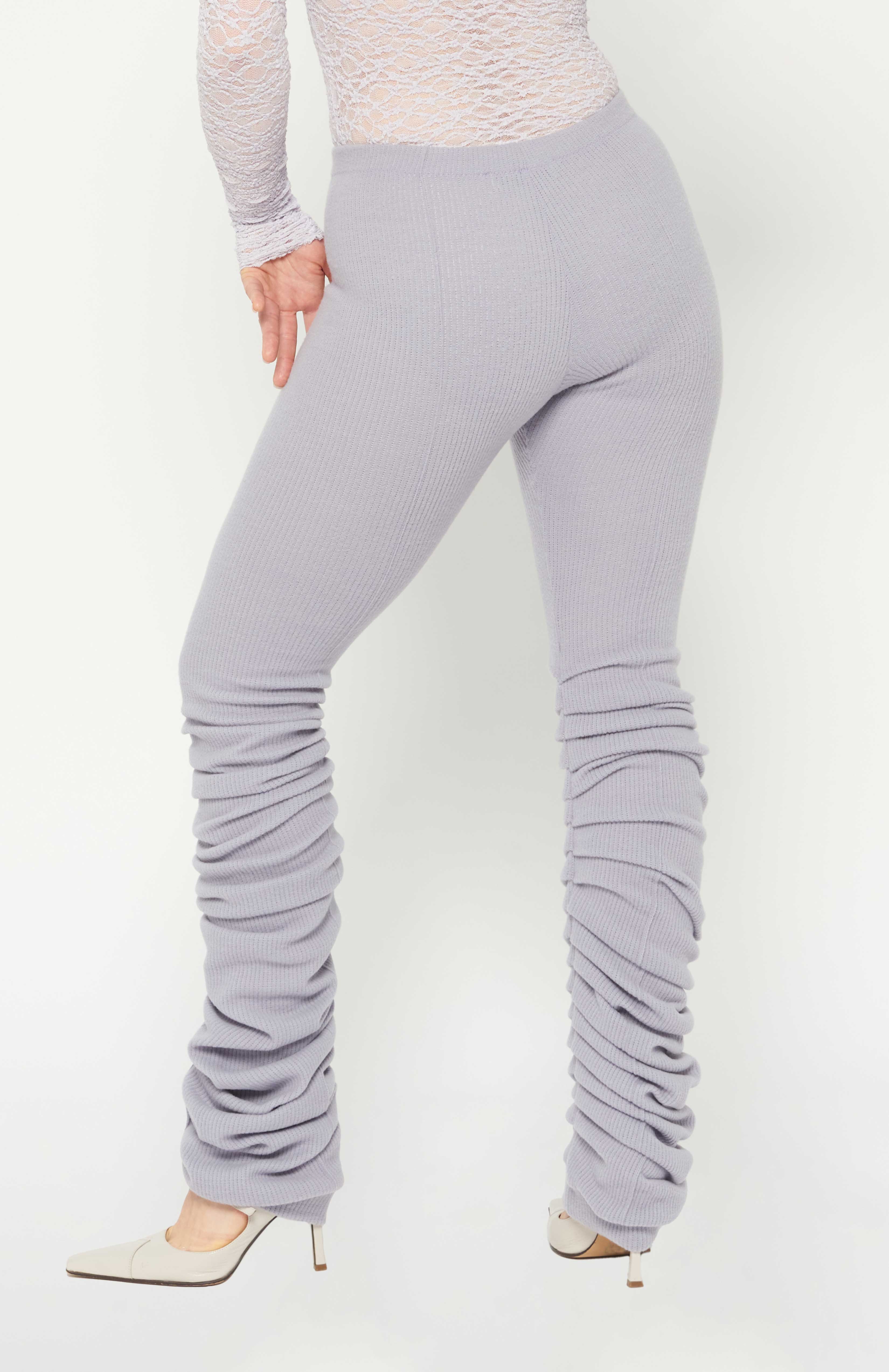 Maroske Peech High-rise wool-blend warm-up lilac leggings. Pleated inseam starts from the knee for a lamb leg effect. Flattering pin tucks run along the back and front of both legs giving you visual cues to correct your lines in the mirror.